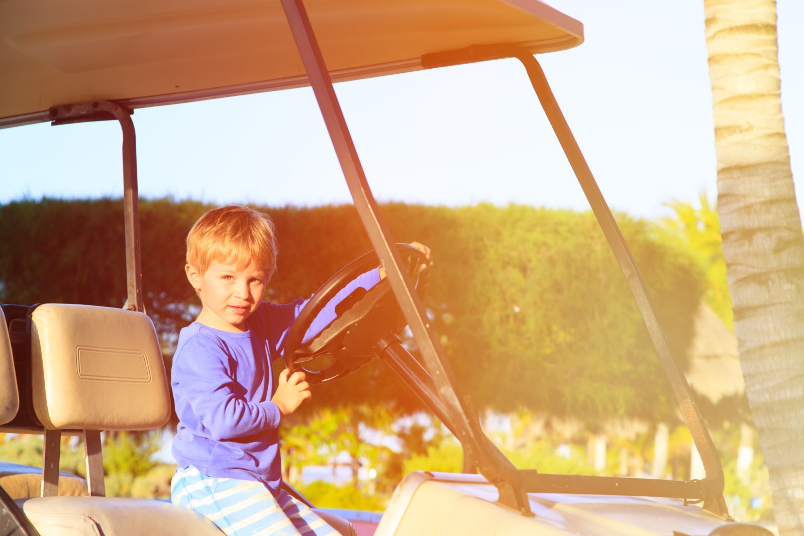 dauphin island boy in golf cart