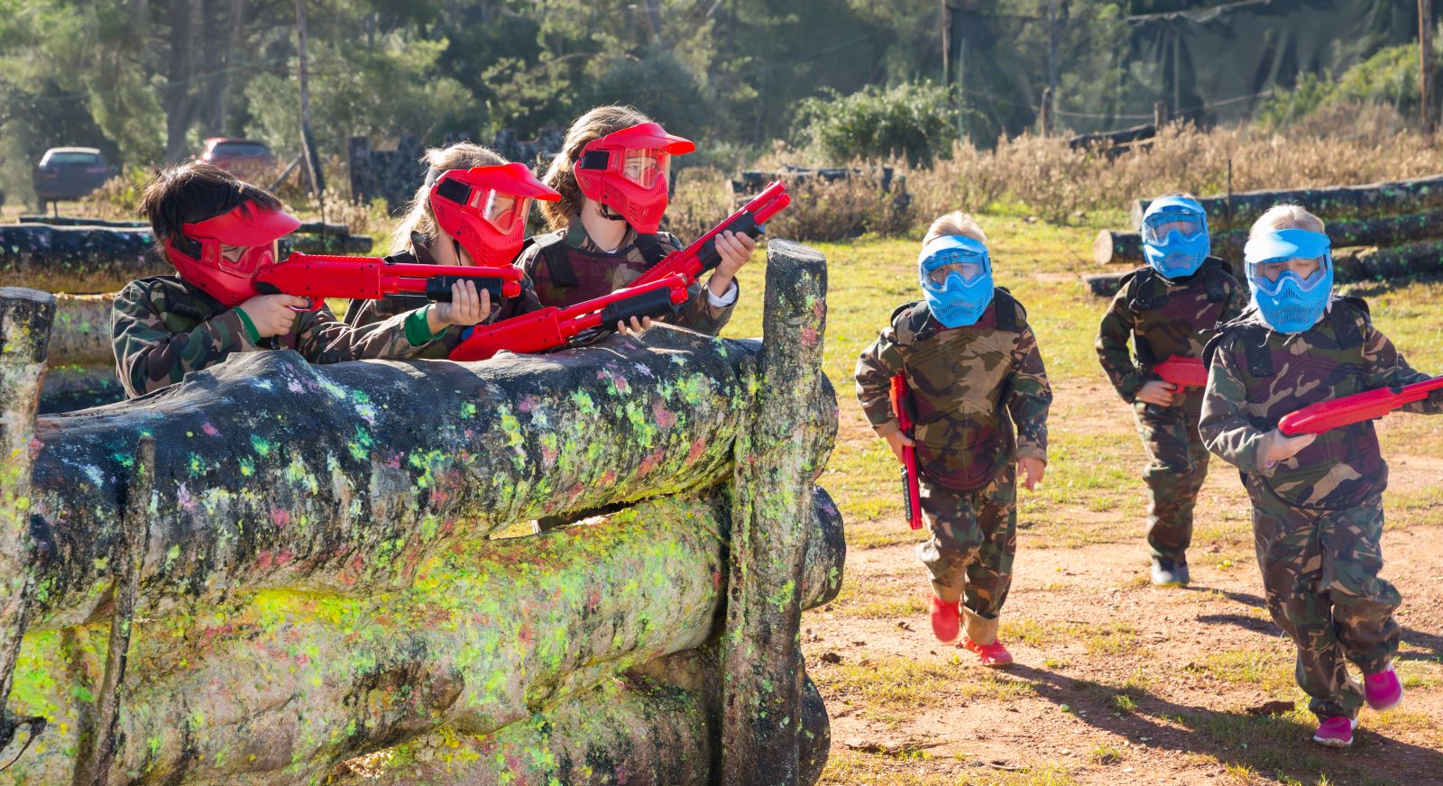 kids playing paintball outdoors