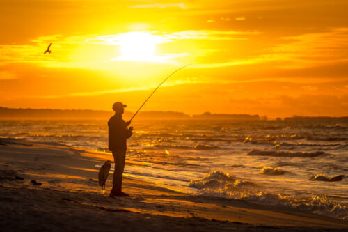 man fishing on Dauphin Island
