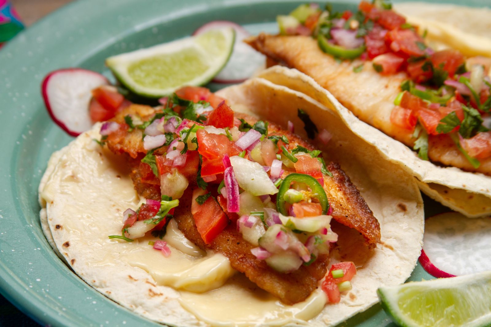 Two fish tacos on a plate
