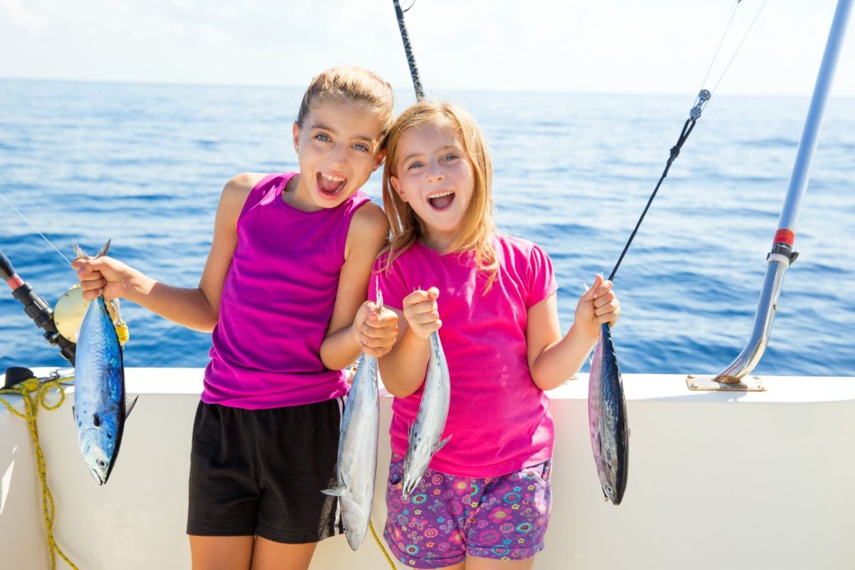 Kids holding up their fish